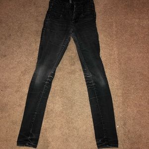 Distressed black skinny jeans